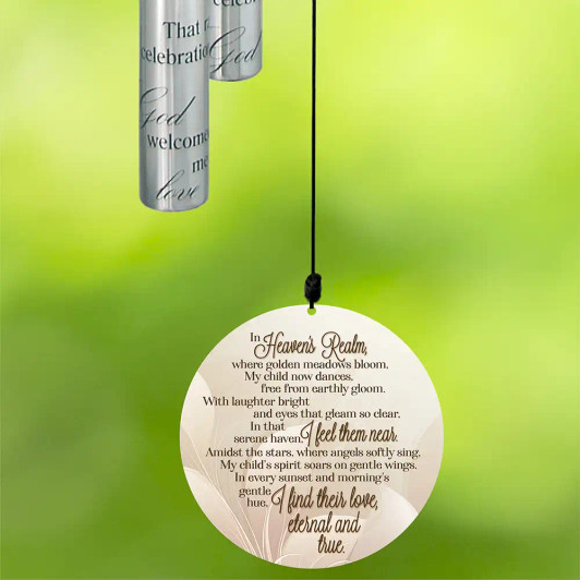 Heaven's Realm memorial wind chime for loss of child features a poem on the front of the sail. Heaven's Realm memorial wind chime for loss of child features a poem on the front of the sail.