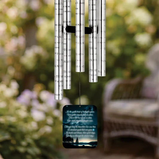 A Child's Light Memorial Chime sail featuring poem "A child's light still lingers near" — personalized with child's name and dates