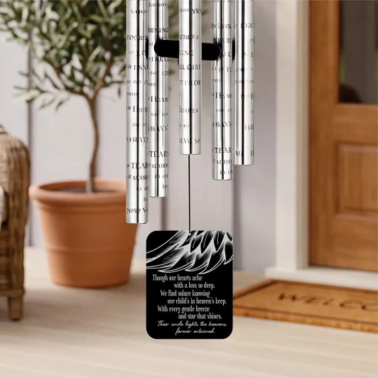 Our Angel Child Memorial Chime sail featuring angel wing design and poem "We find solace knowing our child's in heaven's keep" — personalized with child's name and dates