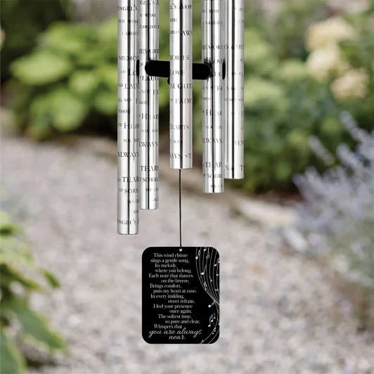 A Gentle Breeze Memorial Wind Chime sail featuring poem "The softest tune, so pure and clear, whispers that you are always near" — personalized with name and dates