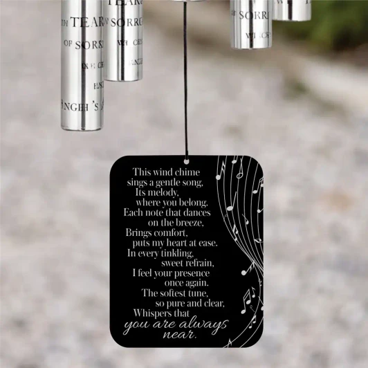 A Gentle Breeze Memorial Wind Chime sail featuring poem "The softest tune, so pure and clear, whispers that you are always near" — personalized with name and dates