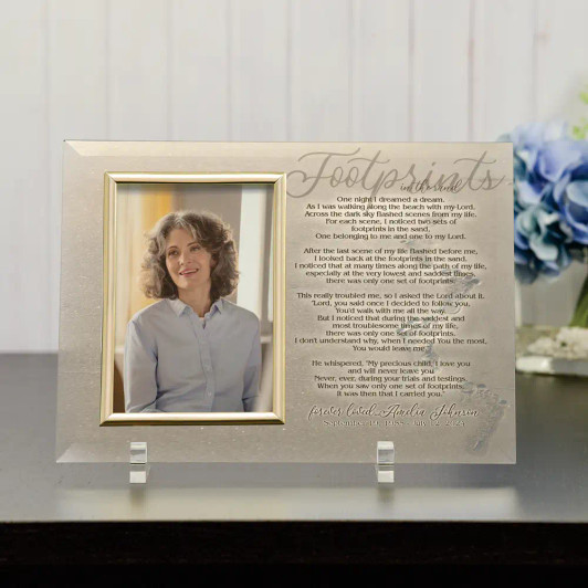 Footprints in the Sand glass memorial frame holding a 4x6 photo, featuring the Footprints poem, personalized with name and dates