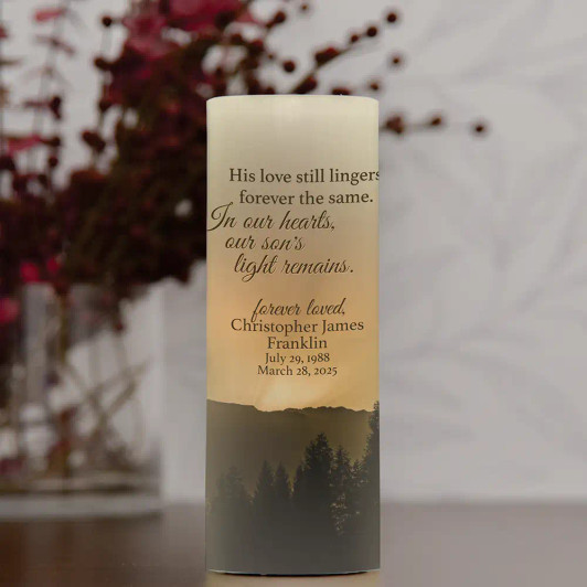 Personalized candle to pay tribute to a son who has passed is personalized with his name and dates.