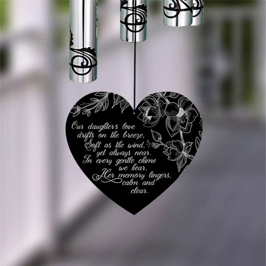 Our Daughter's Memory Wind Chime has a beautiful poem on the front of the wind sail