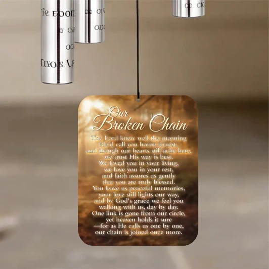 Aluminum chime tubes printed with the memorial verse 'in angel's arms you were carried away'