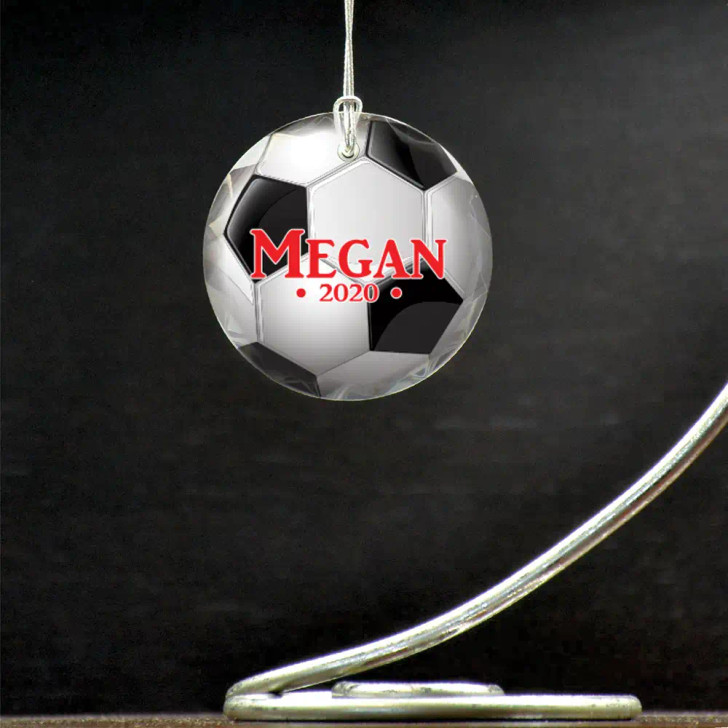 Personalized soccer ornament features a printed soccer ball, their name