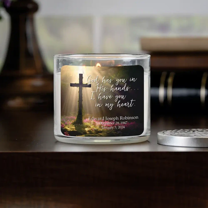 In God's Hands memorial candle, personalized with a loved one's name and dates