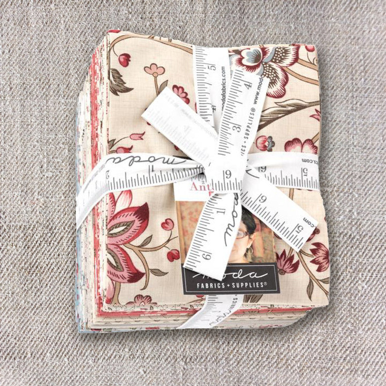 photo of Antoinette fat quarter bundle, 29 fabrics, tied with tape ribbon