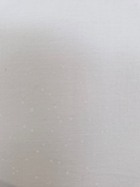 small random white dots printed on a white background