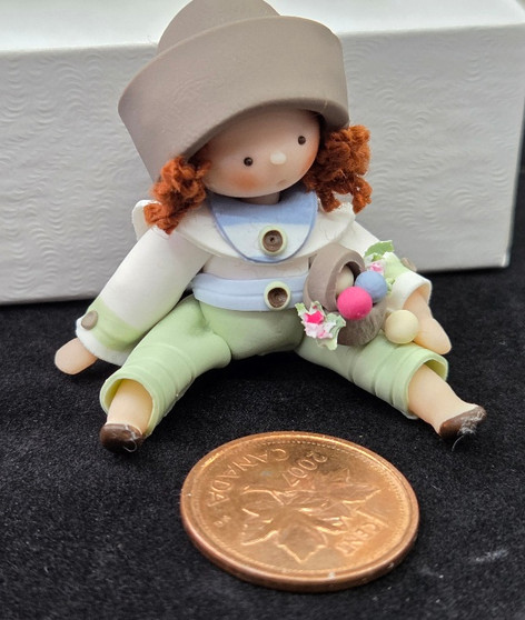 AB26-191 - Handcrafted Clay Girl with Flowers