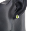 9ct White Gold Pear Cut Peridot Stud Earrings - Worn View