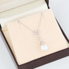 18ct White Gold Pearl and Diamond Lady Sybil Pendant by Ungar and Ungar - Worn View - In Box