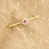 Second Hand 9ct Gold Ruby and Pearl Cluster Bar Brooch - On Fabric