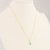 9ct Gold Blue Topaz Pendant with Chain - Worn View