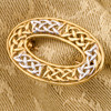 9ct Two Colour 9ct Gold Oval Celtic Knot Brooch - On Fabric