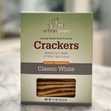 Cream and silver box with window revealing crackers.