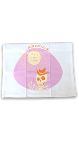 white towel with image of the sun and a skeleton on a pink background 