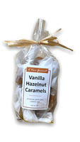 Plastic bag filled with brown caramels and tied with brown ribbon.