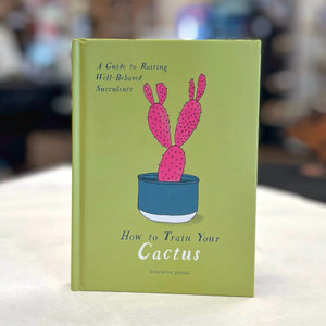 Front book cover in green with drawing of a prickly pear cactus in a blue pot Front book cover in green with drawing of a prickly pear cactus in a blue pot