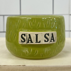 green ceramic bowl with the pattern of a prickly pear cactus and the word 'Salsa' on a white back ground with black lettering