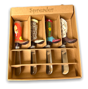 Four spreaders with handles shaped as cowboy boots in red, light brown, dark brown and white with brown. In a light brown gift box.