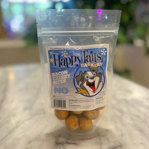 Clear plastic resealable food pouch showing contents of brownish orange dog treats with blue and white front label