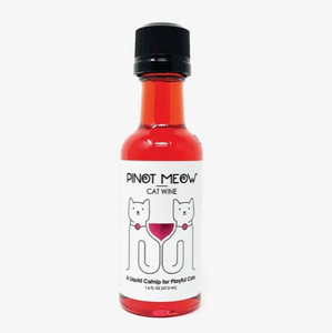 Clear plastic bottle showing red liquid with black cap and white label