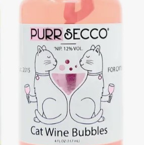 Clear plastic bottle with light pink liquid and white label