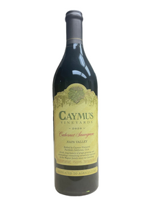 Dark glass wine bottle with yellow front label with green lettering and vines
