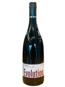 Dark glass wine bottle with white label and light red lettering