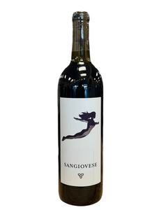 Dark glass wine bottle with white front label with image of a woman flying