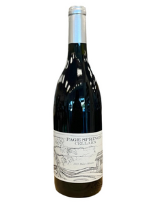 Glass wine bottle with white front label with drawing of vineyard