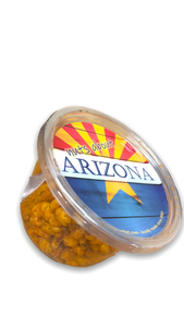 Clear plastic food tub containing golden corn nuts