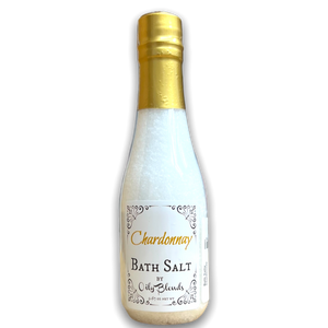 wine bottle shaped plastic bottle containing white bath salts with a white front label