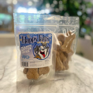 Clear plastic resealable food pouch showing contents of light brown dog treats with blue and white front label