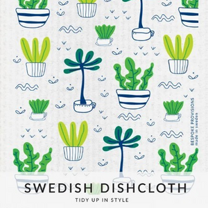 White square dishcloth with different colored plants