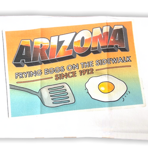 white kitchen towel with image of a fried egg and spatula with Arizona printed along the top