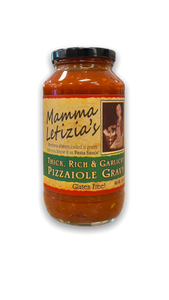 Tall glass round jar with black lid containing red pasta sauce, with a tan label. Tall glass round jar with black lid containing red pasta sauce, with a tan label.