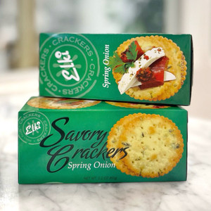 Two stacked green long, rectangular box with image of crackers and lettering in black
