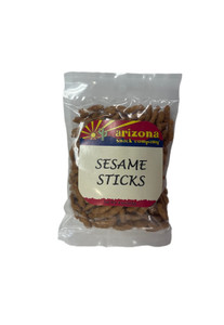 Clear plastic bag holding sesame sticks with a white, red, blue, and yellow label.