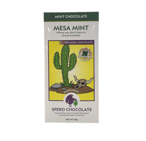 White and green rectangular box with a picture of a cactus, rock, and a bull skull.