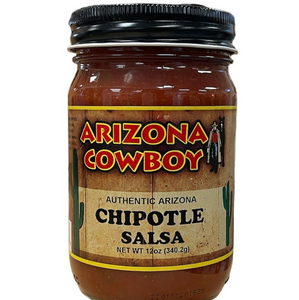 Clear glass jar with black lid showing contents of red salsa with front label in shades of brown and tan.