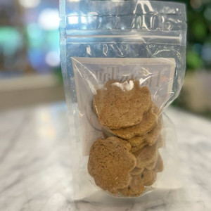 Backside of clear packaging showing contents of light brown round dog treats