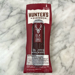 Clear and dark red rectangular packaging with off white label