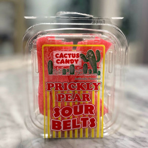 a clear, rectangular plastic tub with the Cactus Candy logo and the product name "Prickly Pear Sour Belts" in bold red letters. Pink sour candy belts are visible in the tub