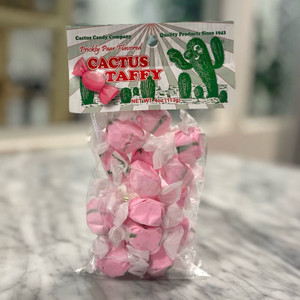 a tall, clear bag showing pieces of pink taffy wrapped individually on the inside. the top of the bag is sealed with a tag reading "Cactus Taffy" and the Cactus Candy logo