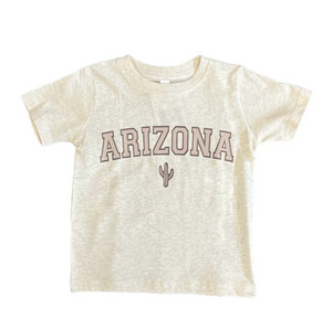 Light tan t-shirt with "Arizona" across the front in a darker tan and a small cactus