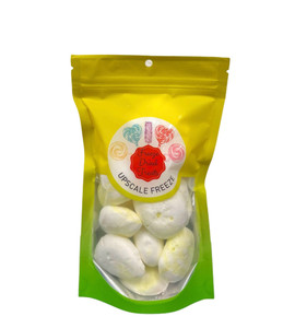 a green and yellow ombre bag with the Upscale Freeze logo and an open window showing off balls of pale yellow and white taffy