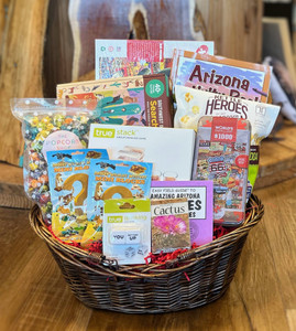 Brown oval wicker basket displaying basket contents. See product description for list of gift contents