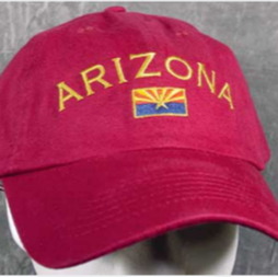 Burnt red colored baseball style had with "Arizona" in golden yellow and the Arizona flag.